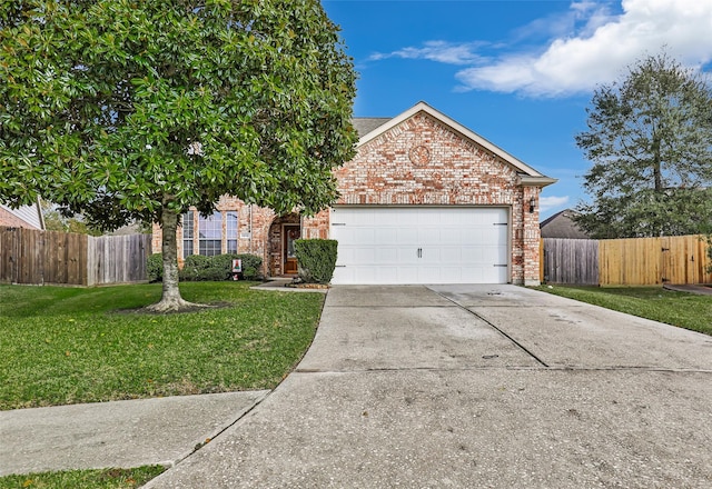 view of front of house featuring a front yard and a garage