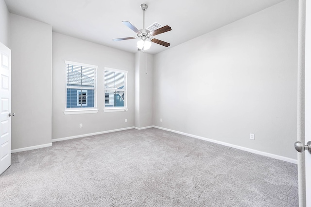 spare room with carpet flooring and ceiling fan