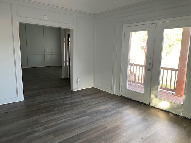 empty room featuring dark wood-type flooring and french doors