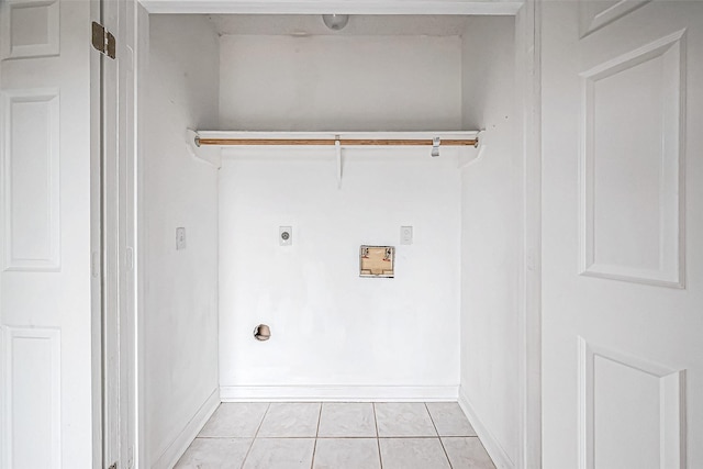 clothes washing area featuring electric dryer hookup, hookup for a washing machine, and light tile patterned floors