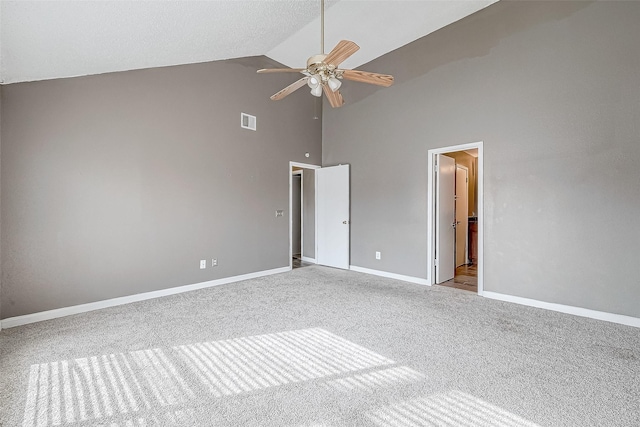 unfurnished bedroom with a textured ceiling, ceiling fan, light carpet, and high vaulted ceiling