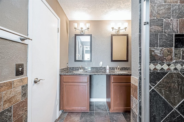 bathroom featuring vanity and a textured ceiling