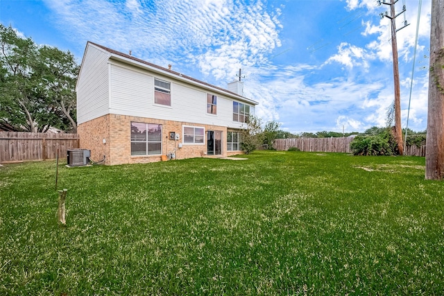 back of property featuring a yard and cooling unit