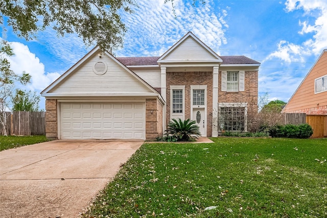 view of front of property with a front yard and a garage