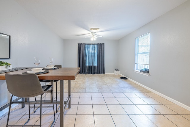 tiled dining room featuring ceiling fan