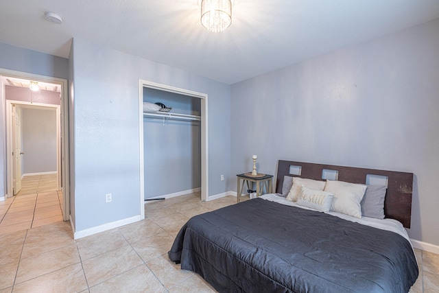 bedroom with light tile patterned floors and a closet