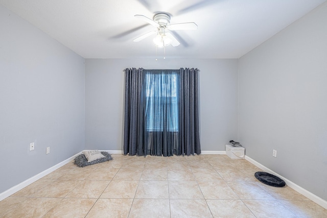 unfurnished room with light tile patterned flooring and ceiling fan