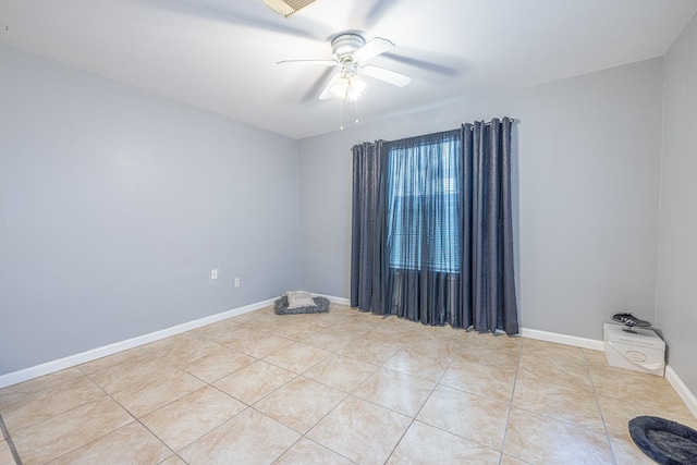 unfurnished room with ceiling fan and light tile patterned flooring