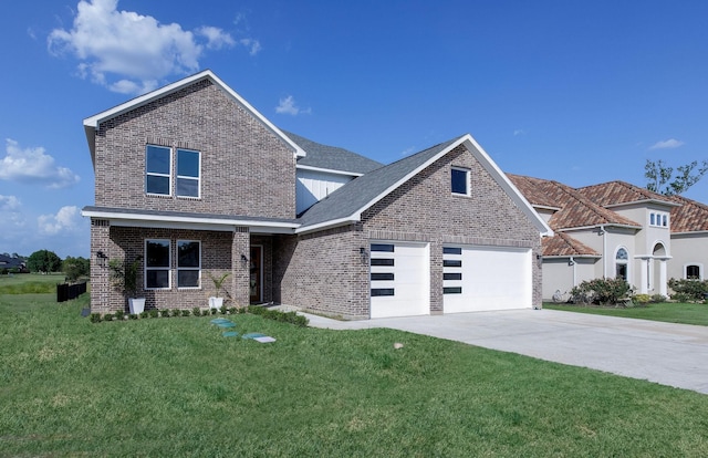 view of front of home featuring a front yard and a garage