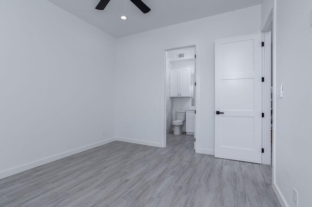 empty room featuring light hardwood / wood-style floors and ceiling fan