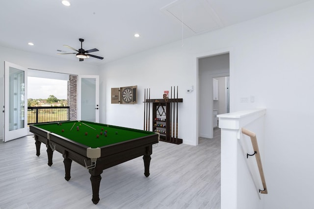 playroom with ceiling fan and light hardwood / wood-style floors