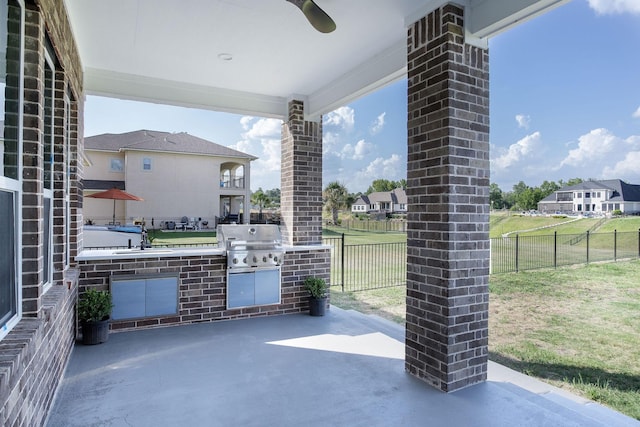 view of patio featuring area for grilling, ceiling fan, sink, and grilling area