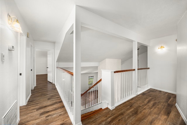 corridor featuring dark hardwood / wood-style floors