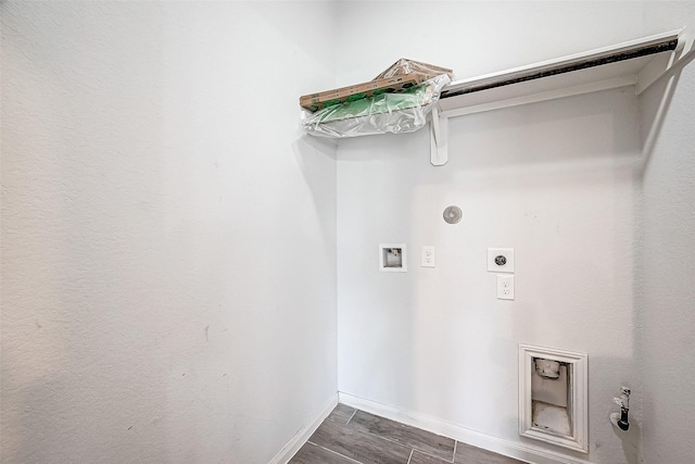 washroom with hookup for an electric dryer, hookup for a gas dryer, dark hardwood / wood-style flooring, and washer hookup