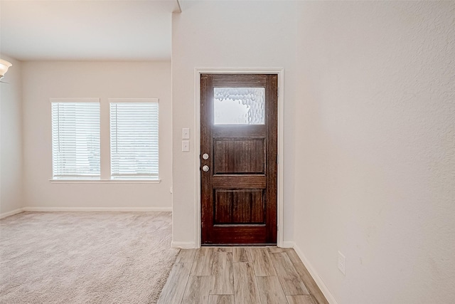 foyer entrance with light wood-type flooring