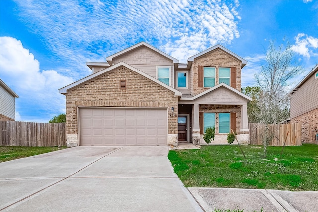 craftsman-style house with a garage and a front lawn