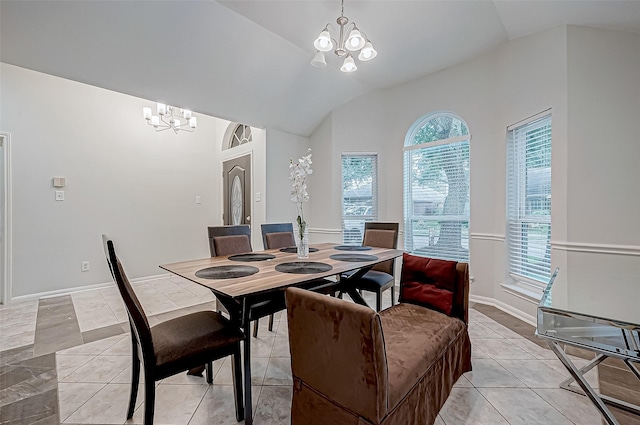 dining room featuring lofted ceiling and an inviting chandelier