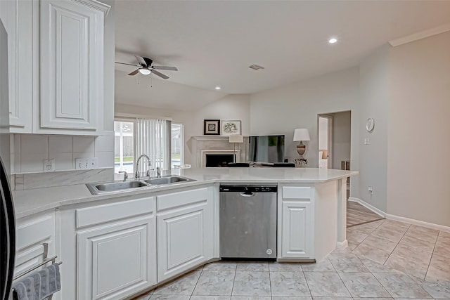 kitchen featuring ceiling fan, dishwasher, white cabinets, and vaulted ceiling