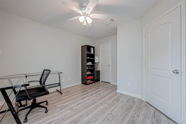 office space featuring light hardwood / wood-style flooring and ceiling fan