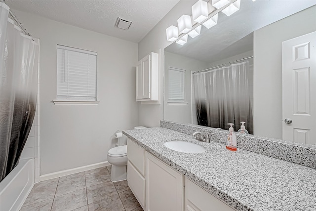 full bathroom with vanity, tile patterned floors, toilet, shower / bathtub combination with curtain, and a textured ceiling