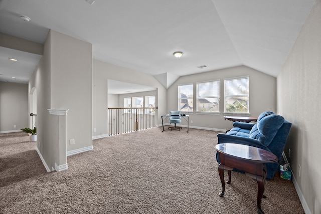 living area with carpet flooring and lofted ceiling