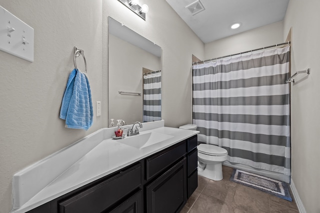 bathroom with tile patterned floors, vanity, toilet, and a shower with shower curtain