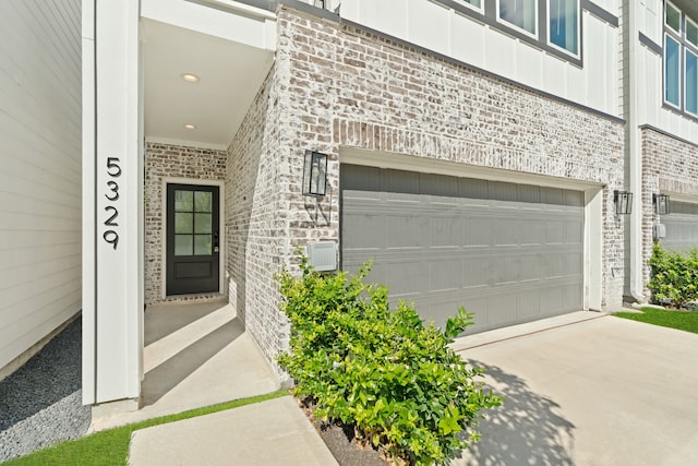 view of exterior entry featuring a garage