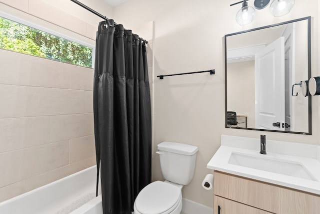 full bathroom with shower / bath combo, toilet, and vanity