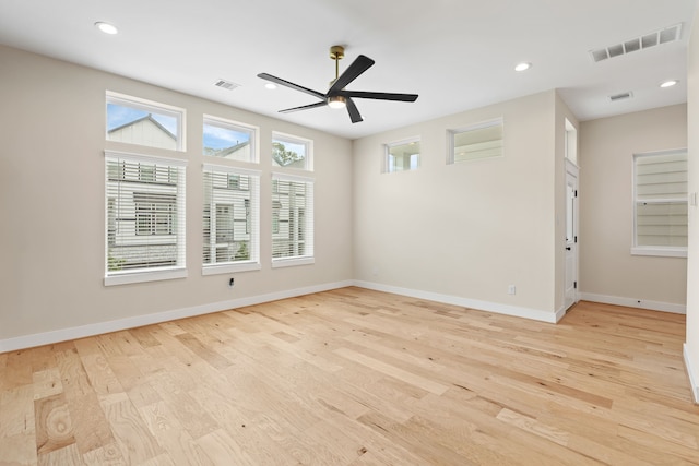 spare room featuring ceiling fan and light wood-type flooring