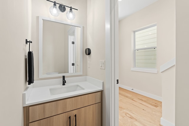 bathroom with vanity and hardwood / wood-style flooring