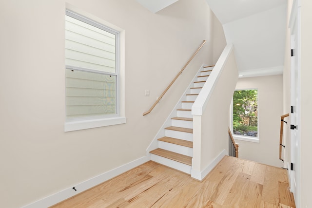 stairway with wood-type flooring