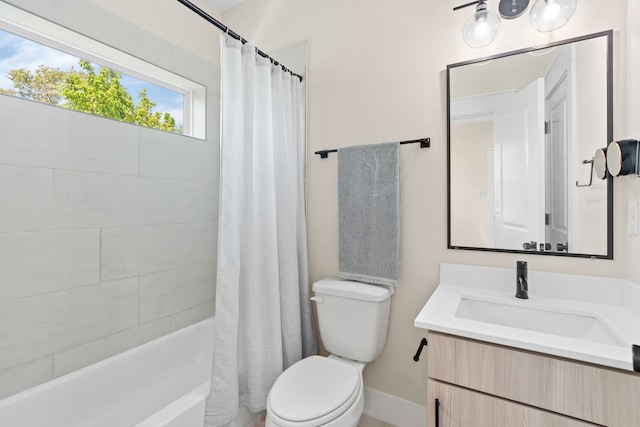 full bathroom with vanity, shower / bath combo, and toilet