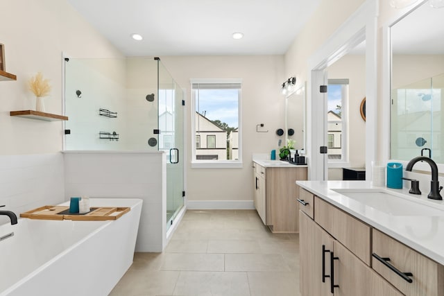 bathroom featuring vanity, tile patterned floors, and independent shower and bath