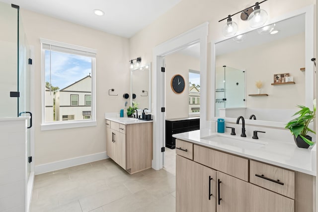 bathroom with tile patterned flooring, vanity, and a shower with shower door