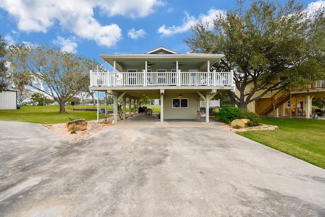 beach home with a carport and a front yard