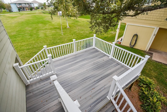 wooden terrace with a yard