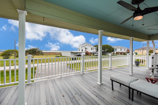 wooden terrace featuring ceiling fan