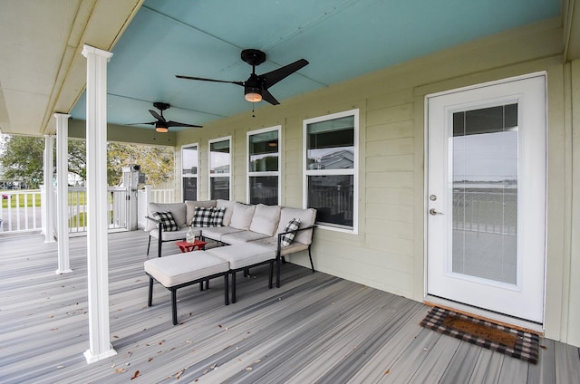 wooden terrace with a porch and an outdoor hangout area