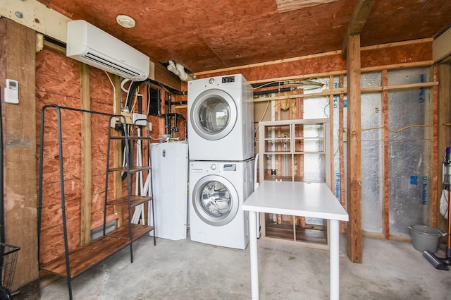 laundry area with a wall unit AC, stacked washer / dryer, and water heater