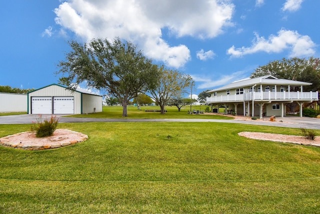 view of yard with a garage and an outdoor structure