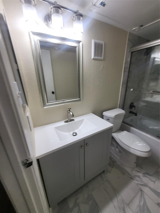 full bath featuring visible vents, toilet, enclosed tub / shower combo, marble finish floor, and vanity