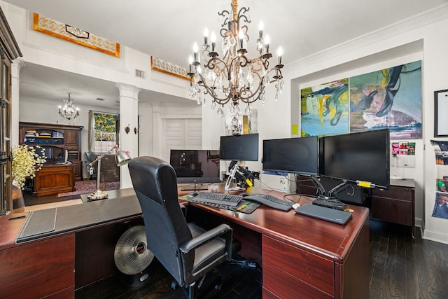 office space featuring an inviting chandelier, ornamental molding, dark wood-type flooring, and decorative columns