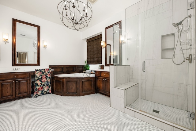 bathroom with shower with separate bathtub, vanity, and an inviting chandelier