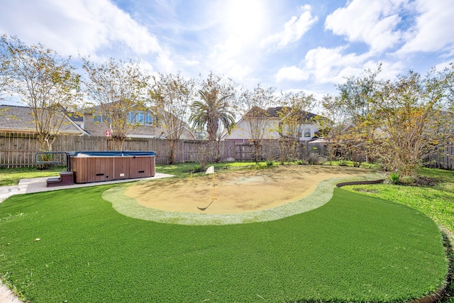 view of yard with a hot tub and a patio area