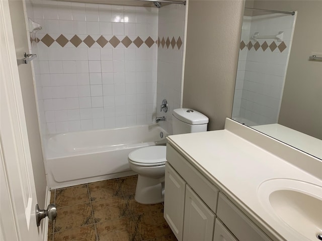 full bathroom featuring vanity, toilet, and tiled shower / bath