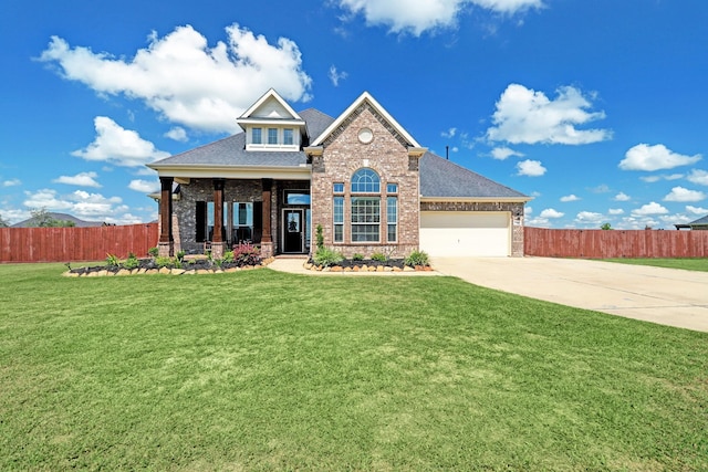 view of front of property with a garage and a front lawn