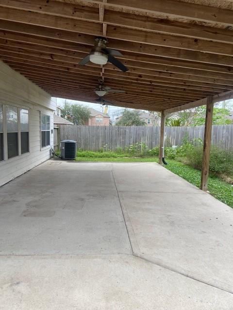 view of patio / terrace with ceiling fan and cooling unit