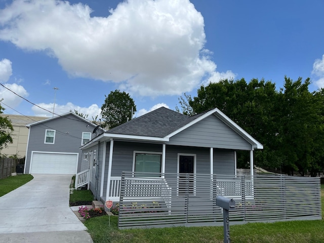 8130 Bassett St, Houston, TX 77051 - view of front of property with covered porch, a shingled roof, driveway, an attached garage, and fence