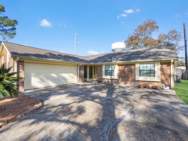 single story home featuring a garage