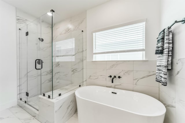 bathroom with independent shower and bath and tile walls